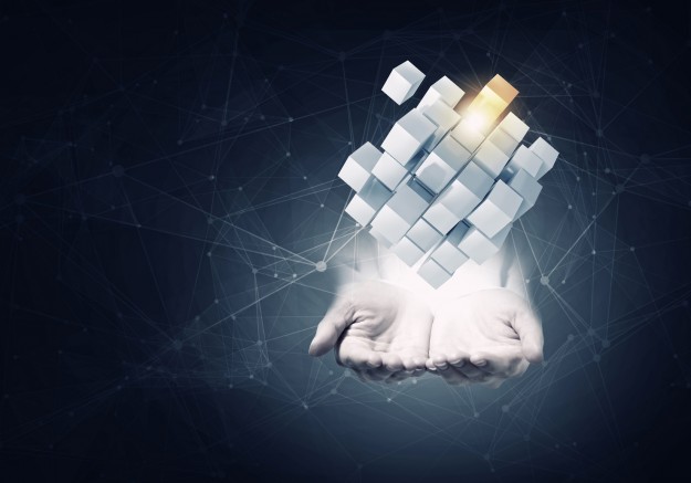 Cube in male hand . Mixed media